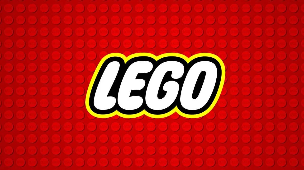 Ceci est le logo de la marque LEGO sur fond de briques rouge.